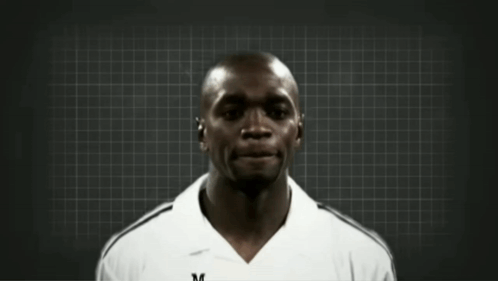 Two Men Are Standing Next To Each Other With One Wearing A White Adidas Shirt GIF