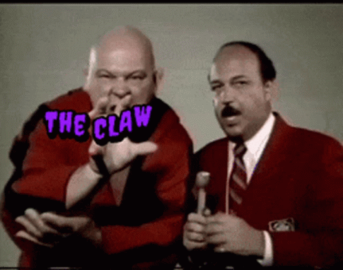 Two Men Are Standing Next To Each Other With The Words The Claw Written Above Them GIF