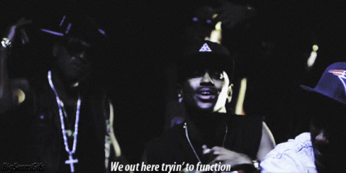 two men are standing next to each other with the words we out here tryin ' to function below them