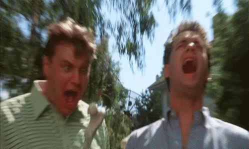 Two Men Are Standing Next To Each Other With Their Mouths Open And One Is Screaming . GIF