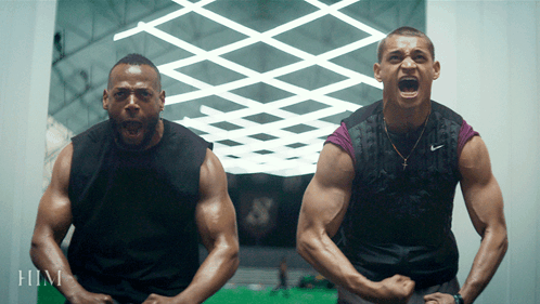 Two Men Are Standing Next To Each Other With Their Mouths Open And The Word Him Is On The Bottom Right GIF