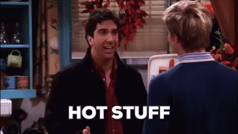 Two Men Are Talking In A Kitchen And One Of Them Is Saying Hot Stuff GIF