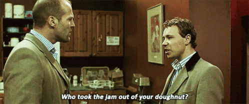 Two Men Are Talking In A Kitchen And One Of Them Says Who Took The Jam Out Of Your Doughnut . GIF