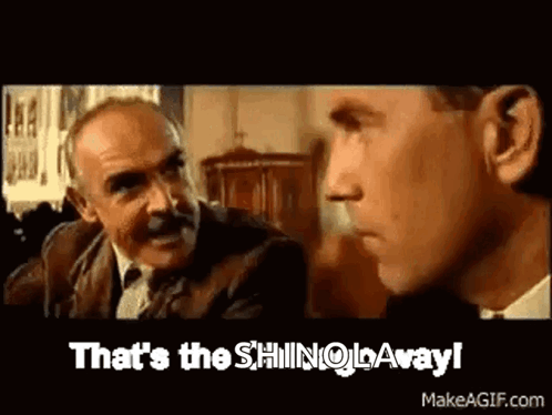 Two Men Are Talking To Each Other And One Of Them Is Saying `` That 'S The Shingo Away '' . GIF