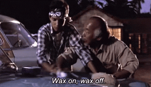 Two Men Are Waxing A Car And One Of Them Says Wax On Wax Off . GIF