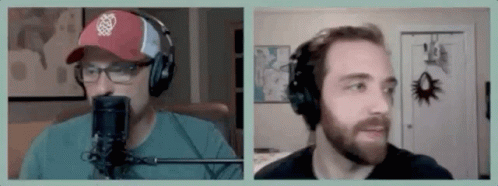 Two Men Are Wearing Headphones And Talking Into Microphones . GIF