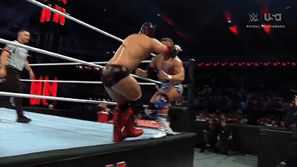 Two Men Are Wrestling In A Ring With A Sign That Says U.s.a. GIF
