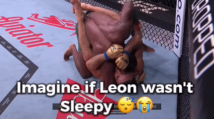 Two Men Are Wrestling In A Ring With The Words Imagine If Leon Wasn 'T Sleepy GIF