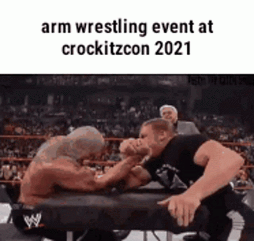 Two Men Arm Wrestling in Ring