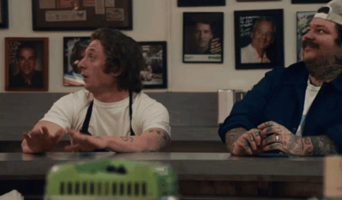 Two Men at Counter with I Love You Tattoo