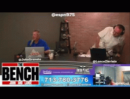 Two Men at Desk With The Bench Banner