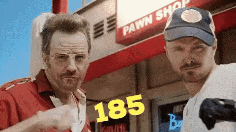 Two Men At Pawn Shop One Wearing Hat 185