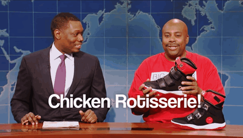 Two Men at Table Saying Chicken Rotisserie