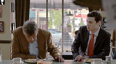 Two Men at Table With Food