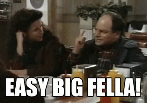 Two Men at Table With Ketchup Saying Easy Big Fella