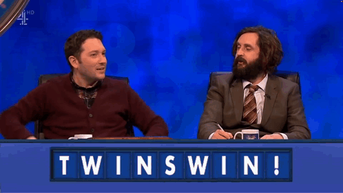 Two Men at Table With Twinswin