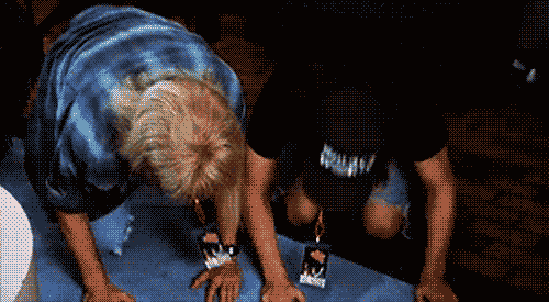 Two Men Bow Down Together GIF