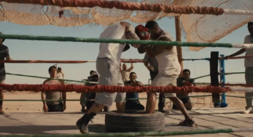 Two Men Boxing in Ring