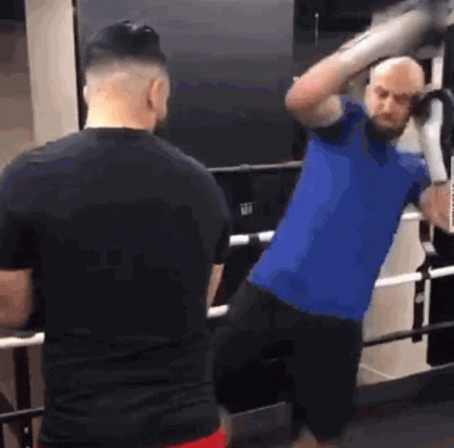Two Men Boxing in Ring