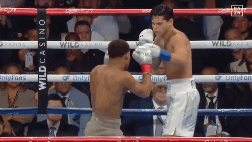 Two Men Boxing in Ring With Casino Banner