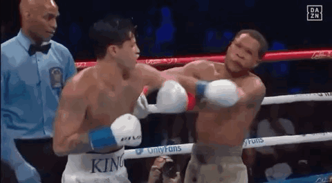 Two Men Boxing in Ring With King Shirt