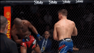 Two Men Boxing In Ring With Referee GIF