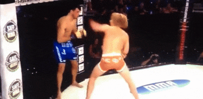 Two Men Boxing In Ring With UFC Banner GIF