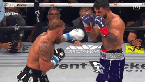 Two Men Boxing in Ring