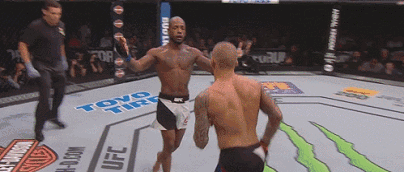 Two Men Boxing in UFC Ring