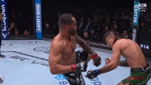 Two Men Boxing with Bud Light Sign