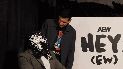 Two Men by AEW Hey Sign