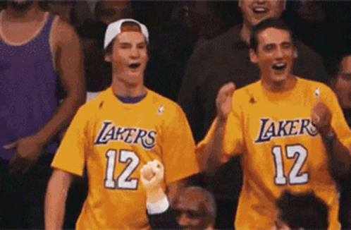 Two Men Cheering in Lakers Shirts