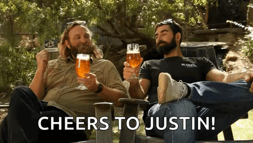 Two Men Cheers to Justin Holding Beer