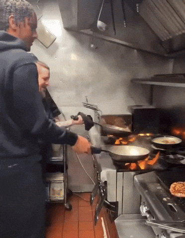Two Men Cooking in Kitchen