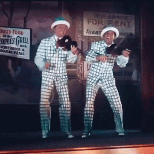 Two Men Dancing by Space for Rent Sign
