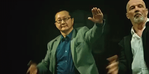 Two Men Dancing In Dark Room GIF