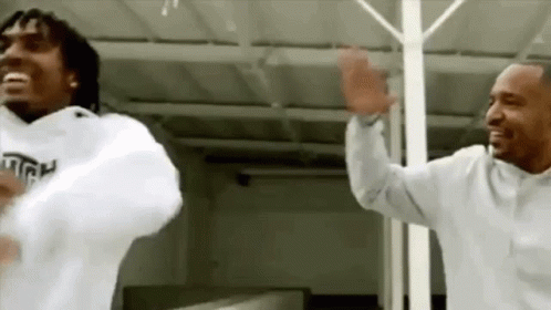 Two Men Dancing in White Sweatshirts