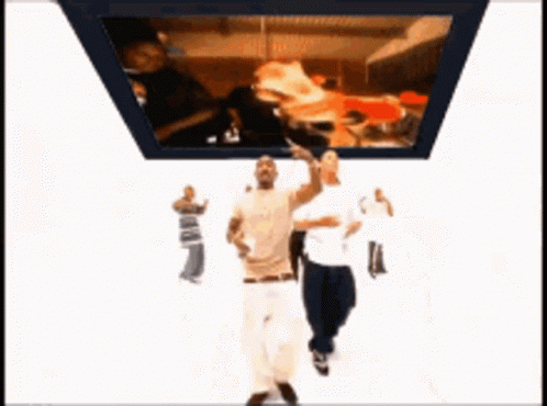 Two Men Dancing Near TV With Pizza GIF