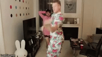 Two Men Dancing With Stuffed Bunny GIF