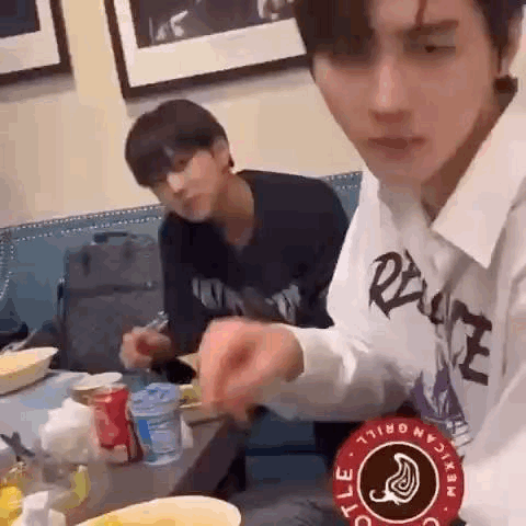 Two Men Eating And Drinking GIF