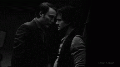 Two Men Face To Face Black And White GIF