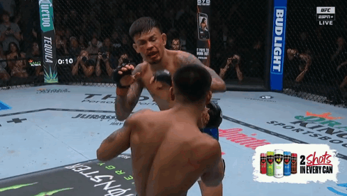 Two Men Fighting in Boxing Ring