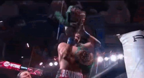 Two Men Fighting in Boxing Ring