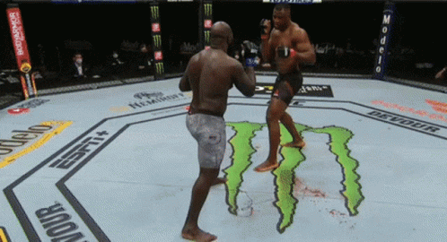 Two Men Fighting in Boxing Ring