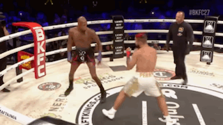 Two Men Fighting in Boxing Ring