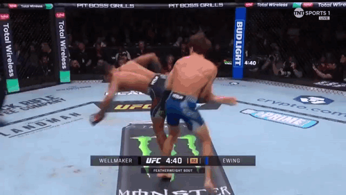 Two Men Fighting in Boxing Ring