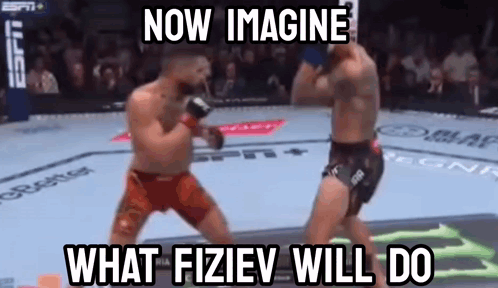 Two Men Fighting in Boxing Ring
