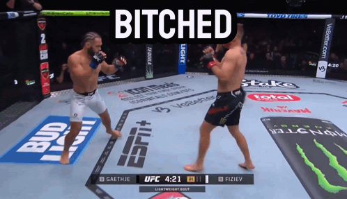 Two Men Fighting in Boxing Ring Bitched