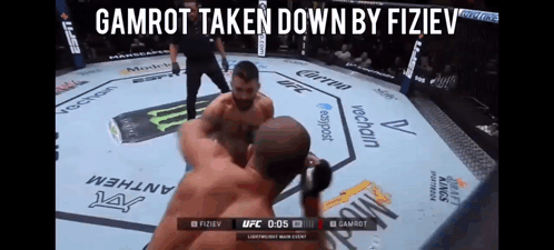 Two Men Fighting in Boxing Ring Gamrot Taken Down by Fiziev