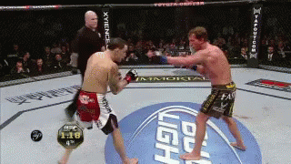 Two Men Fighting in Boxing Ring